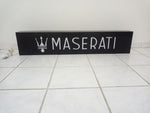 2000s Maserati dealership illuminated sign